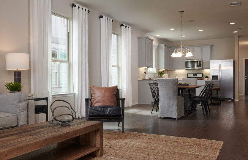 Open floorplan showcasing kitchen, spacious gathering room and dining areas