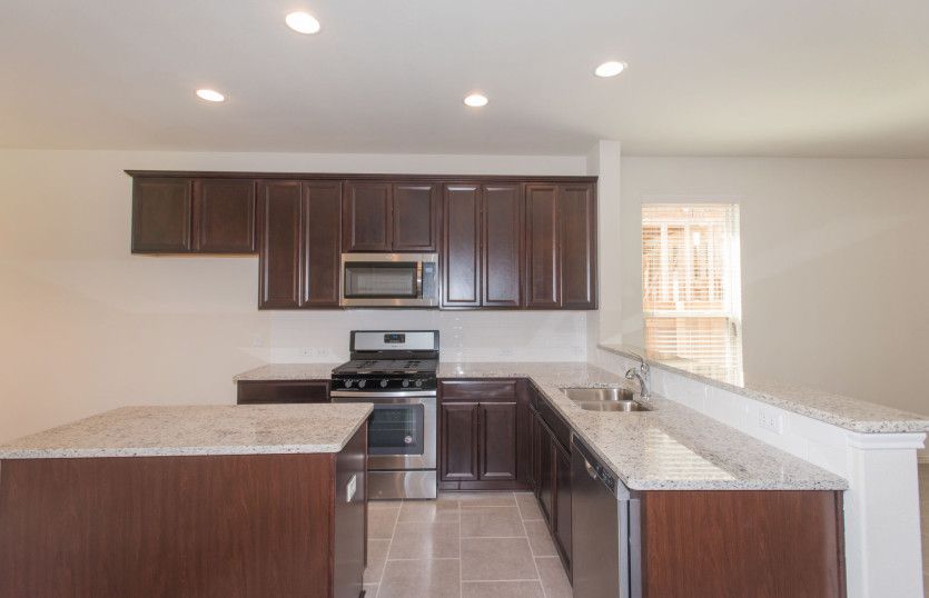 Spacious kitchen with island and abundant cabinet space