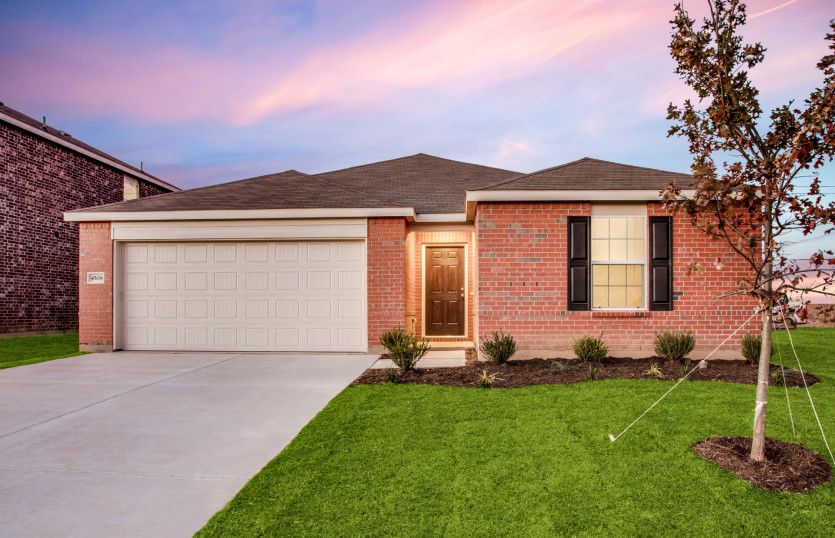The Serenada, a one-story home with 2-car garage, shown with Home Exterior N
