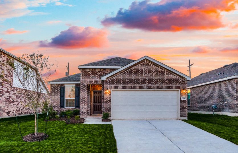 The Independence, a one-story home with 2-car garage, shown with Home Exterior P