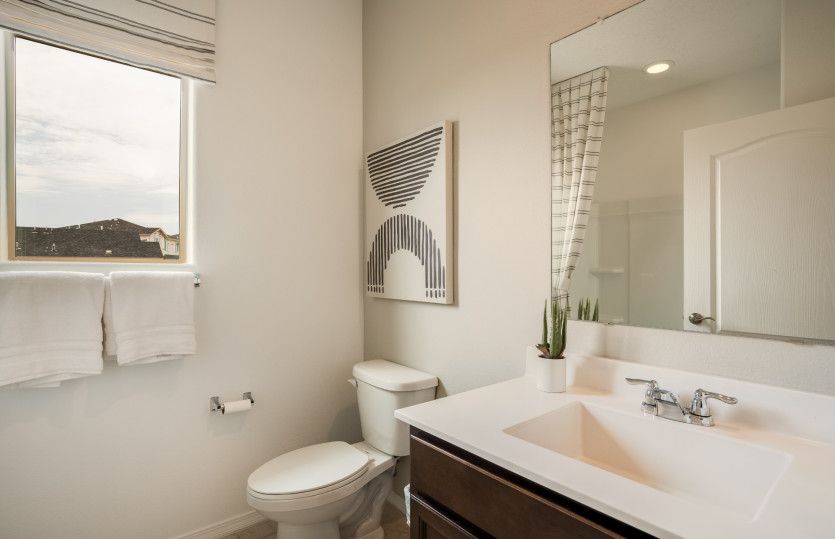 Secondary bathroom separates bed 2 and 3 and features a shower/tub combo.