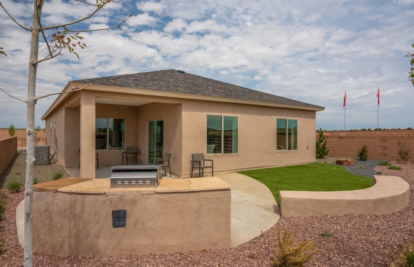 Relax and enjoy the New Mexican weather outside on your backyard covered patio.