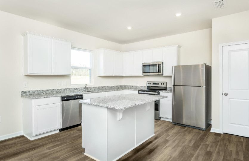 Package A Kitchen with beautiful white cabinets and granite countertops
