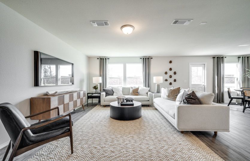 Spacious gathering room with large windows*model representation