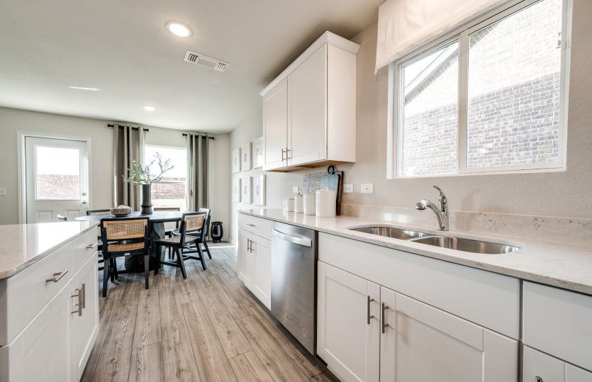 View of dining area from kitchen*model representation