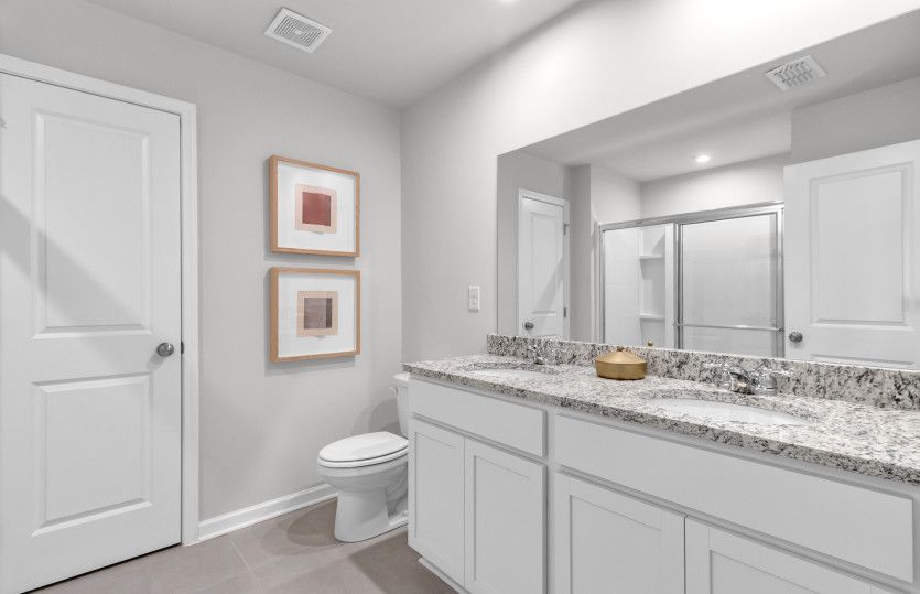 Owner's Bath boosts Dual Sinks & a Linen Closet - Model Representation