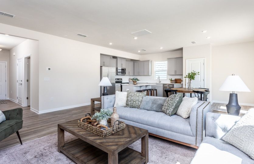 Open-Concept Great Room offers Connectivity to Kitchen & Cafe - Model Representation
