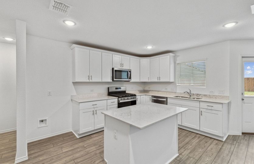 Spacious kitchen with eat-in bartop island