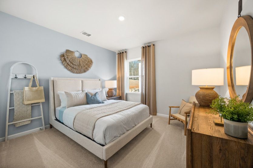 Secondary bedrooms offer a tranquil escape that invites rest and rejuvenation.