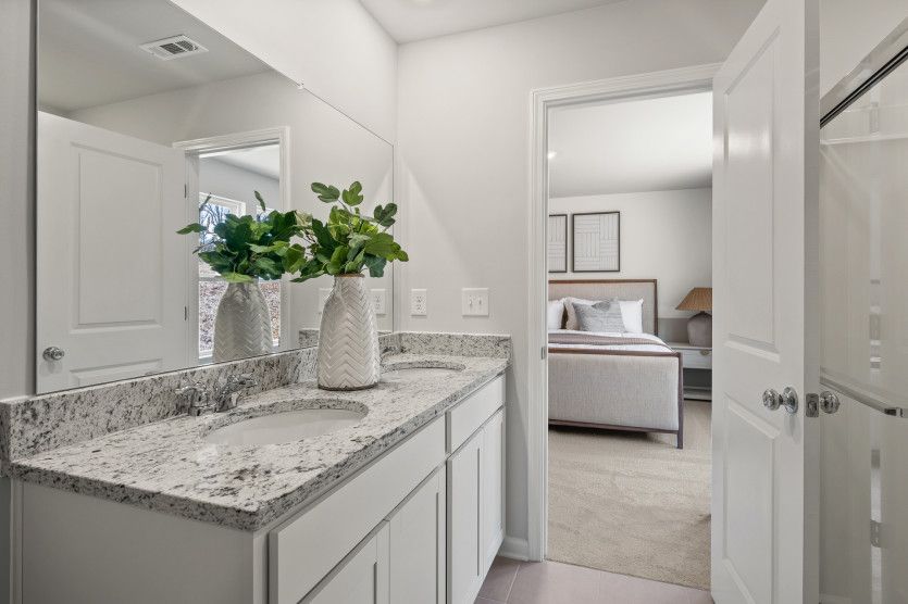Featuring a spa-like walk-in rain shower, the Owner's Bath transforms daily routines.