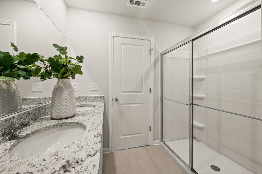 Featuring a spa-like walk-in rain shower, the Owner's Bath transforms daily routines.