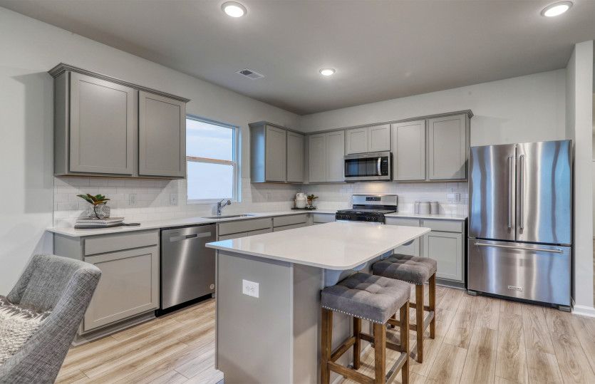 Open Kitchen with stainless steel appliances.