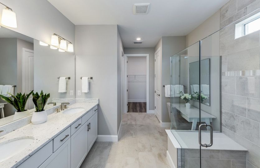 Owner's bath with dual-sink vanity and large shower