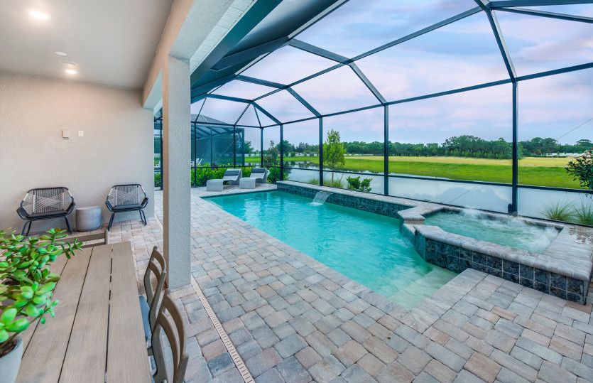 Covered lanai with screened-in pool & spa