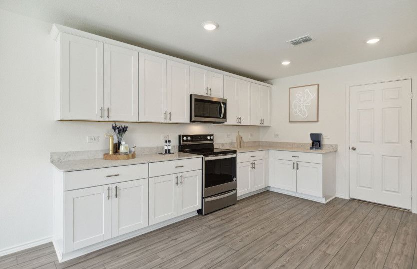 Roomy kitchen designed for functionality and comfort, with plenty of workspace