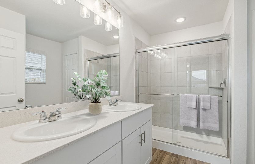 Owner's bath with double vanity and spacious shower
