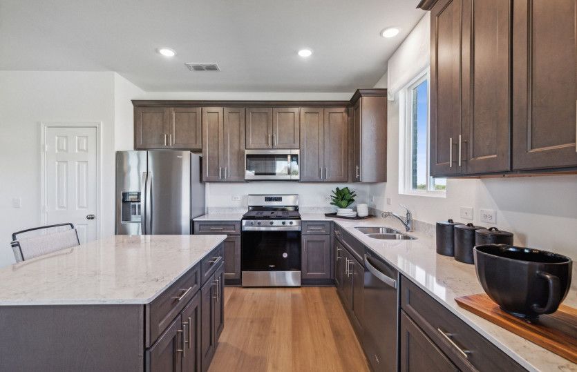 Spacious kitchen with abundant cabinet space*model representation