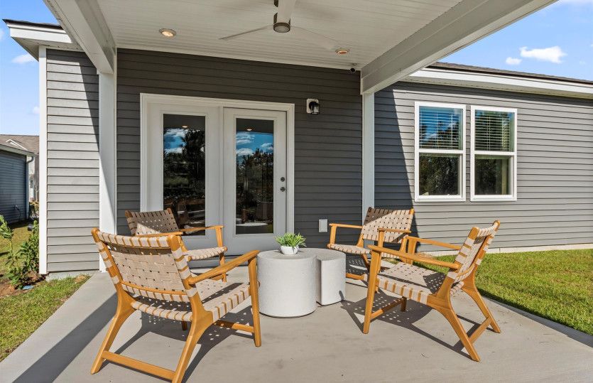 Enjoy outdoor living at its finest with a beautifully designed covered patio of the Starling.