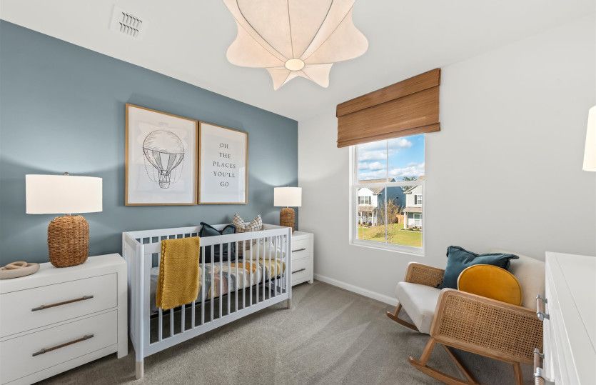 A nursery designed for comfort, warmth, and sweet moments of bonding.