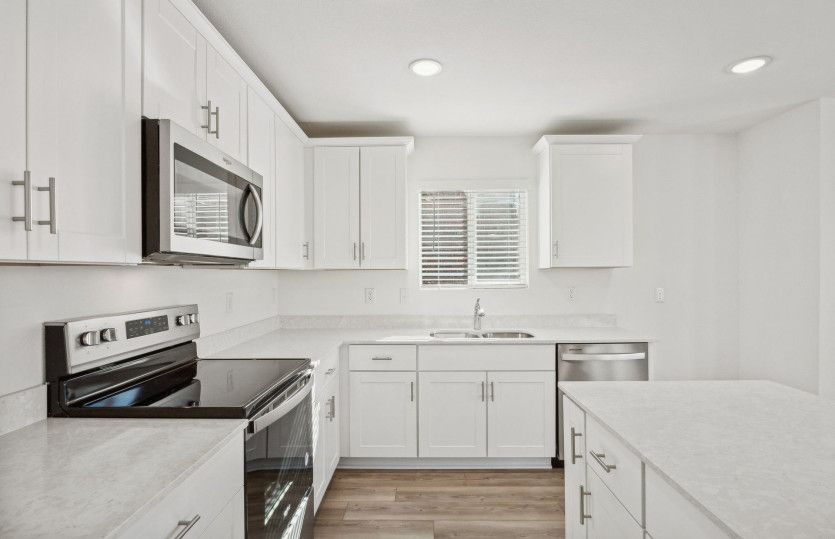 Spacious kitchen with abundant cabinet space*model representation