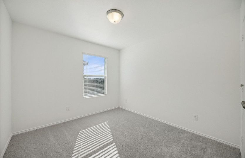 Spacious secondary bedroom*model representation