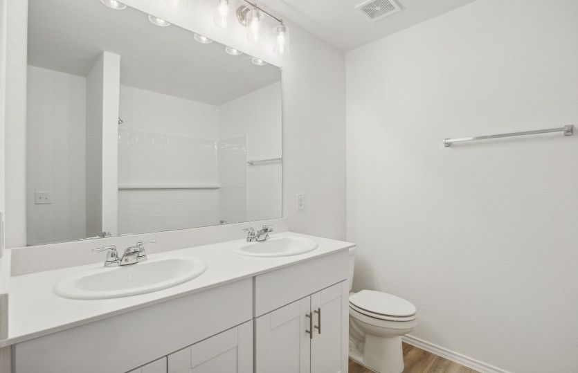 Spacious secondary bathroom*model representation