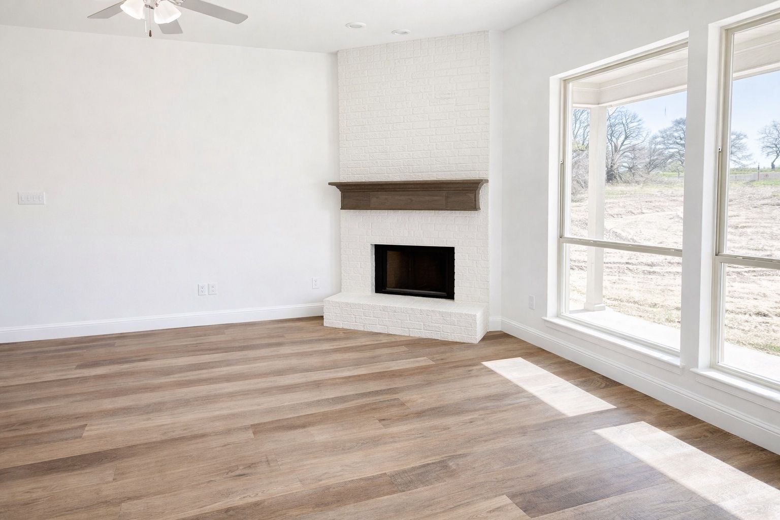 Living Room with Brick Fireplace to Ceiling and Custom Mantle