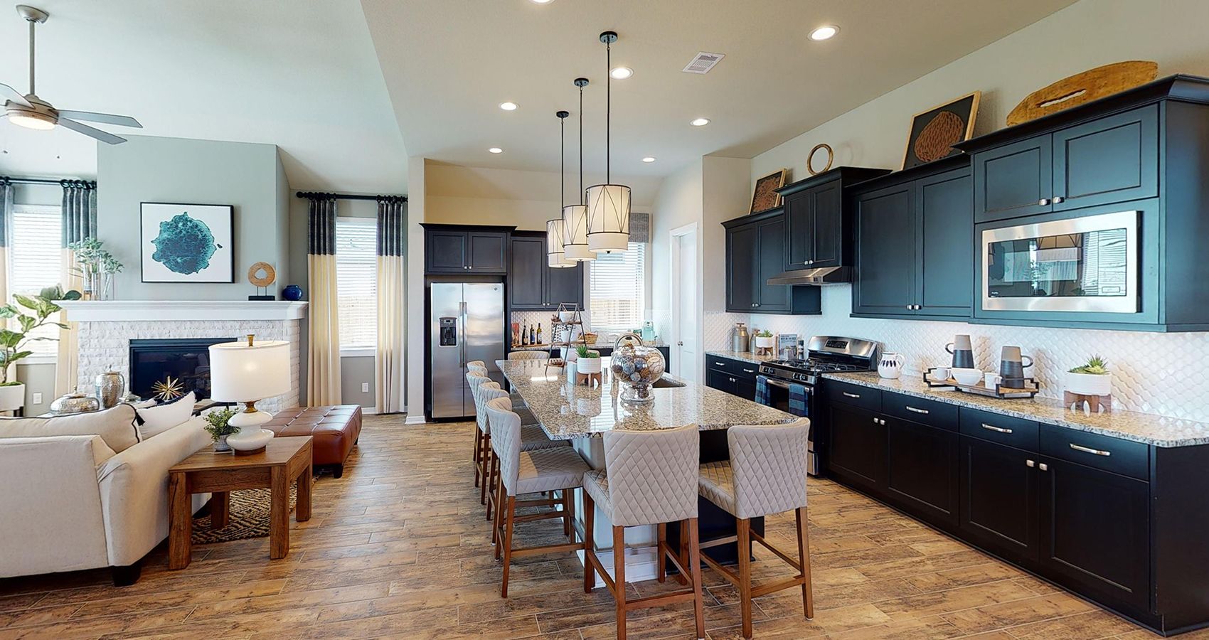 5-HOU-chesmarhomes-HILLCREST-modelhome-Meridiana-kitchenliving.jpg