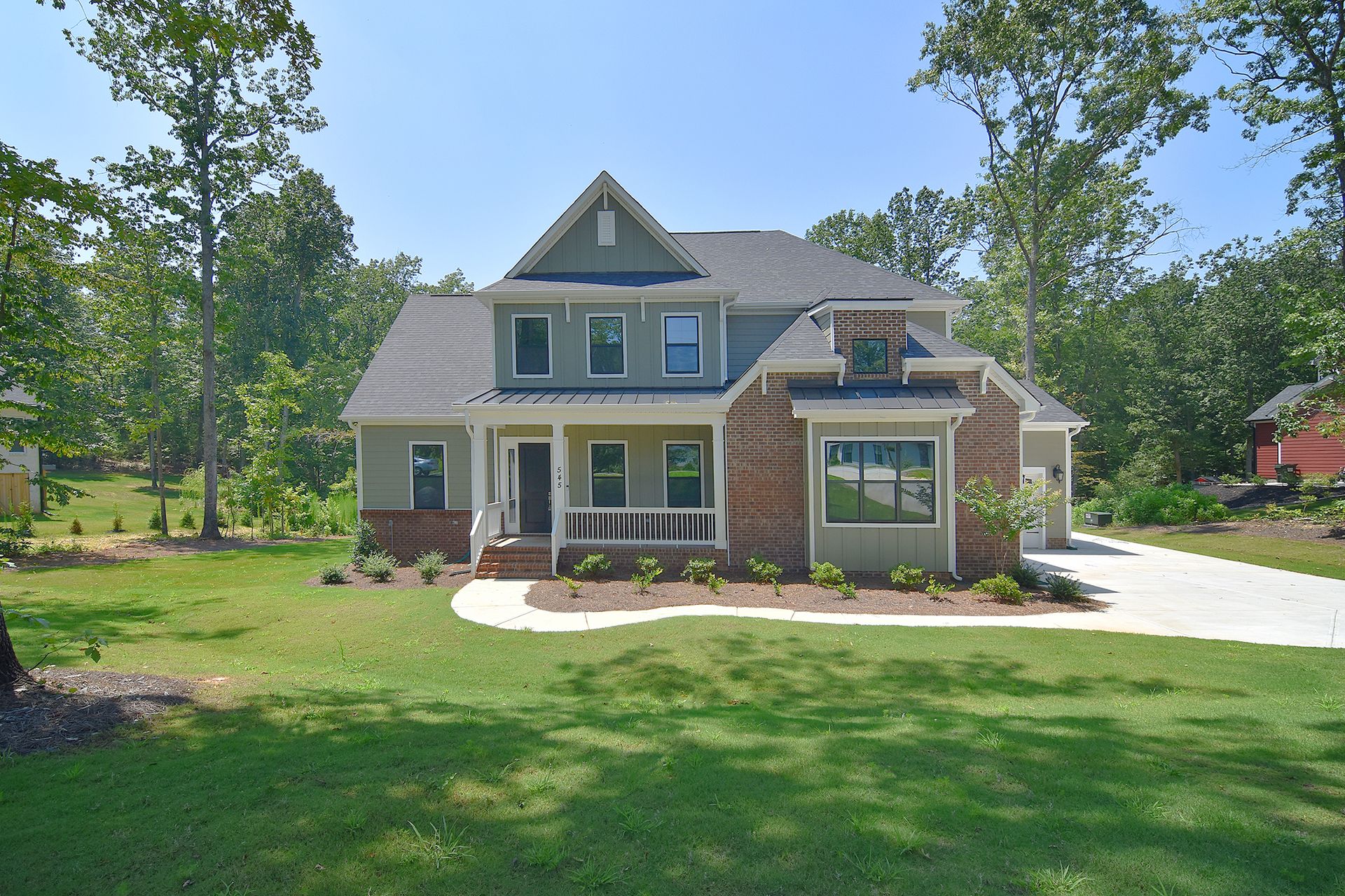  1st Floor Owner's Suite with 10' ceilings on 1st floor, 9' on 2nd, and just over 4000 sf! Kitchen with granite or quartz countertops, double wall oven, and large island opens to Casual Dining & Family Room with coffered ceiling and 2-way fireplace.