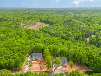 Harbor Watch is a gated community known for seclusion and amenities. Residents enjoy large lots with mature trees, and a lovely walkable neighborhood with hills. It almost feels like a mountain town next to the lake.