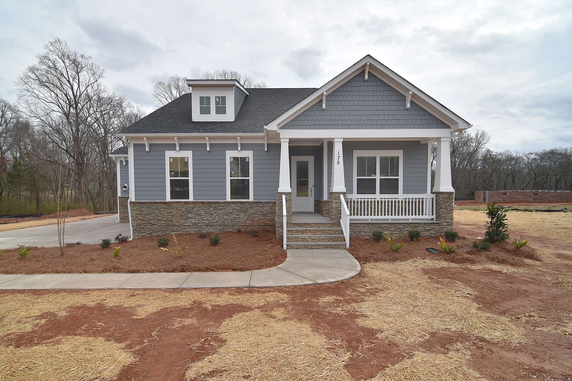  The Muirfield is a spacious Ranch with an open concept. Gourmet Kitchen options include granite or quartz countertops, large island with farmhouse sink, and double ovens.