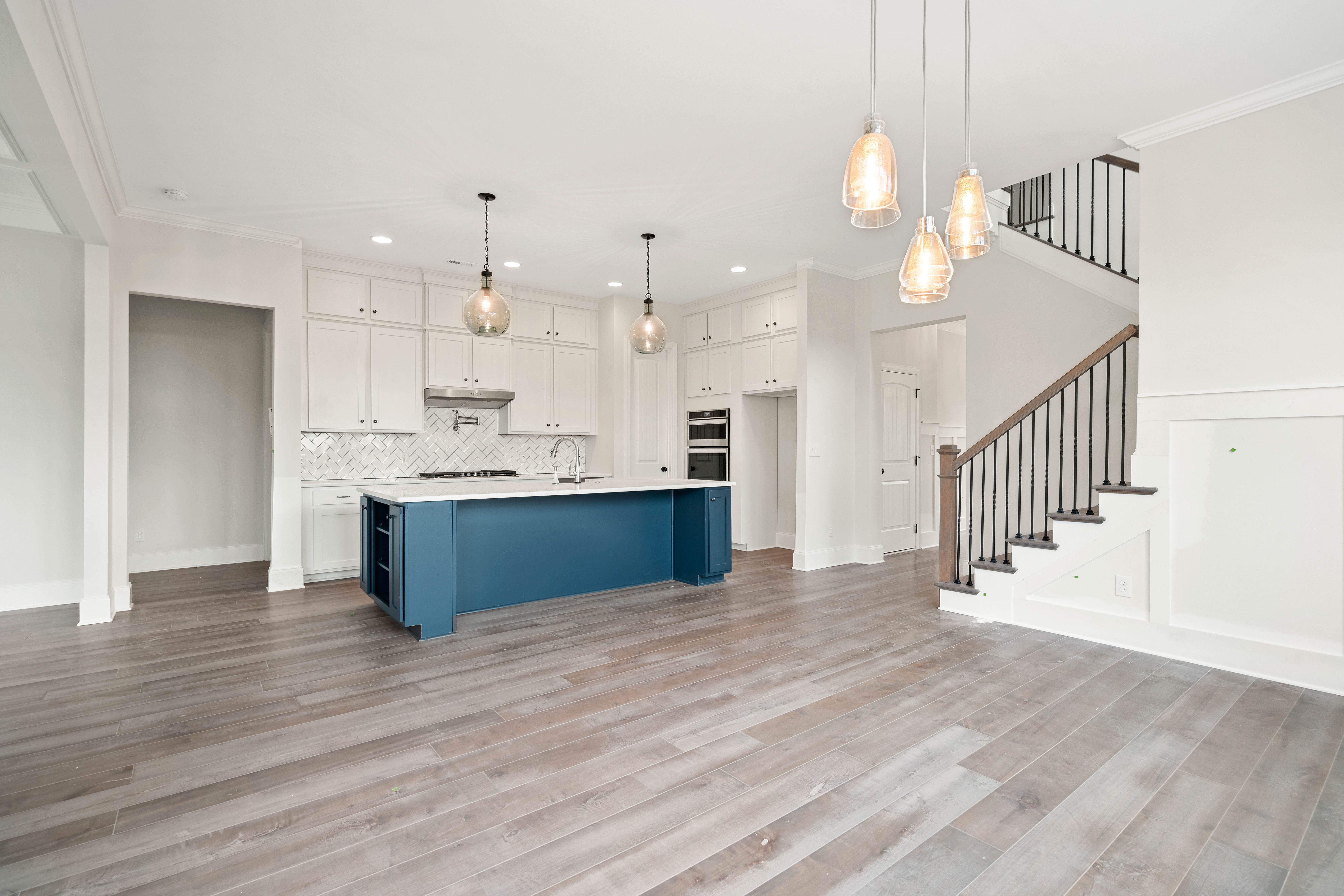 Featuring a nine foot island, walk in pantry, and epicurean design. The Bethpage is perfect for entertaining or relaxing.