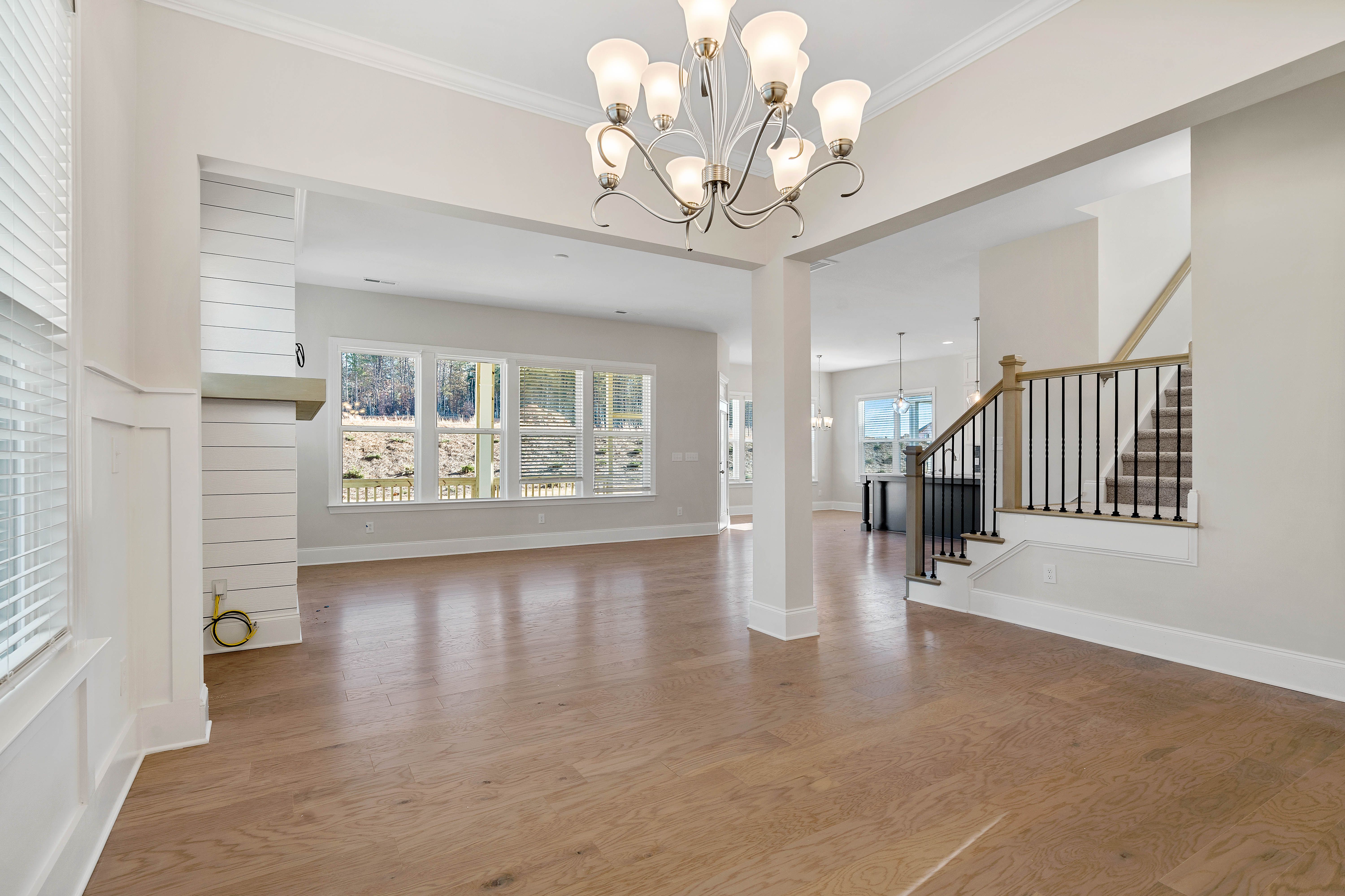 This open-concept kitchen features a large island with a farmhouse sink option, granite or quartz countertops, and double ovens.