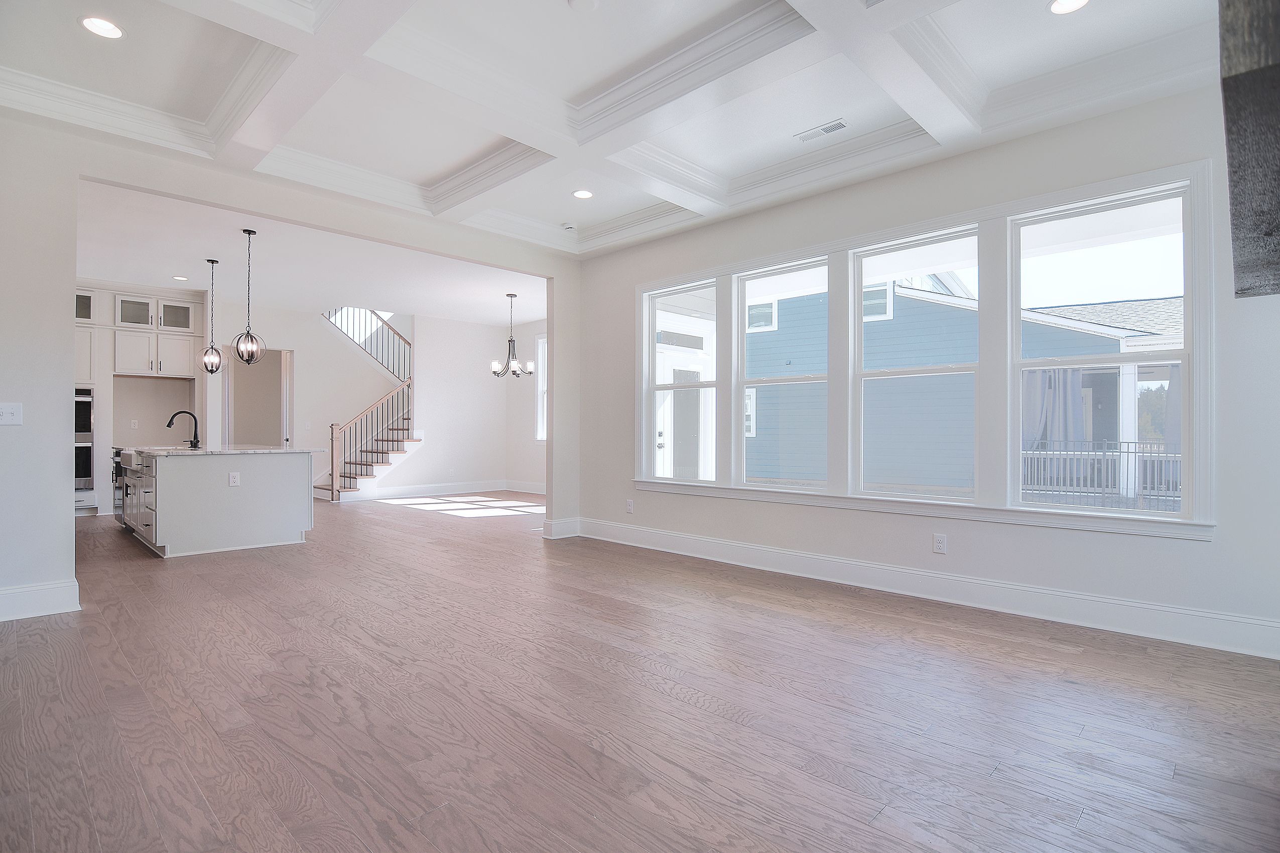  Enjoy the elegance of coffered ceilings in your living room, featuring 10-foot high ceilings. This design adds depth and sophistication, creating a luxurious atmosphere perfect for relaxation and entertaining.