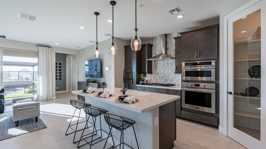 Elegant marble countertops blend seamlessly with custom cabinetry in The Villas at Mystic.