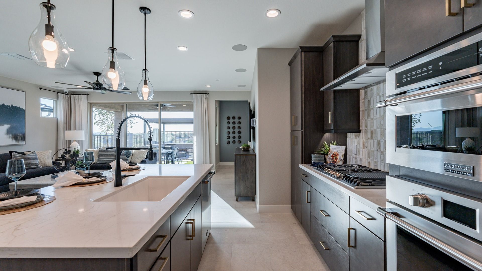 Experience elegance with marble countertops and sleek cabinetry in Mystic Villas' exquisite kitchen.