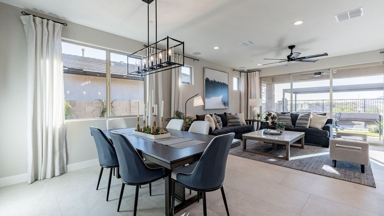 Expansive windows and sleek interiors define this exquisite Mystic living room, blending style and comfort seamlessly.