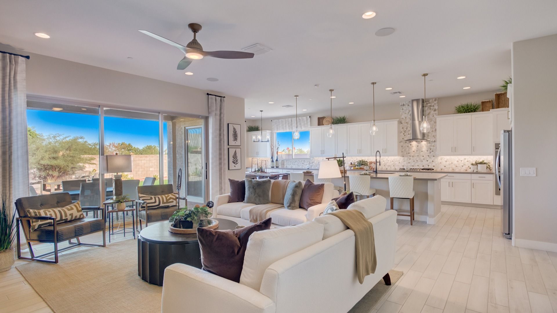 Indulge in luxurious open-concept living with chic pendant lights and elegant cabinetry in Arroyo Seco.