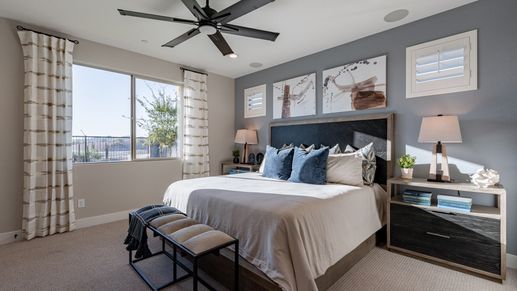 Enjoy sophisticated design with plush fabrics and contemporary art in this Mystic Villas bedroom.