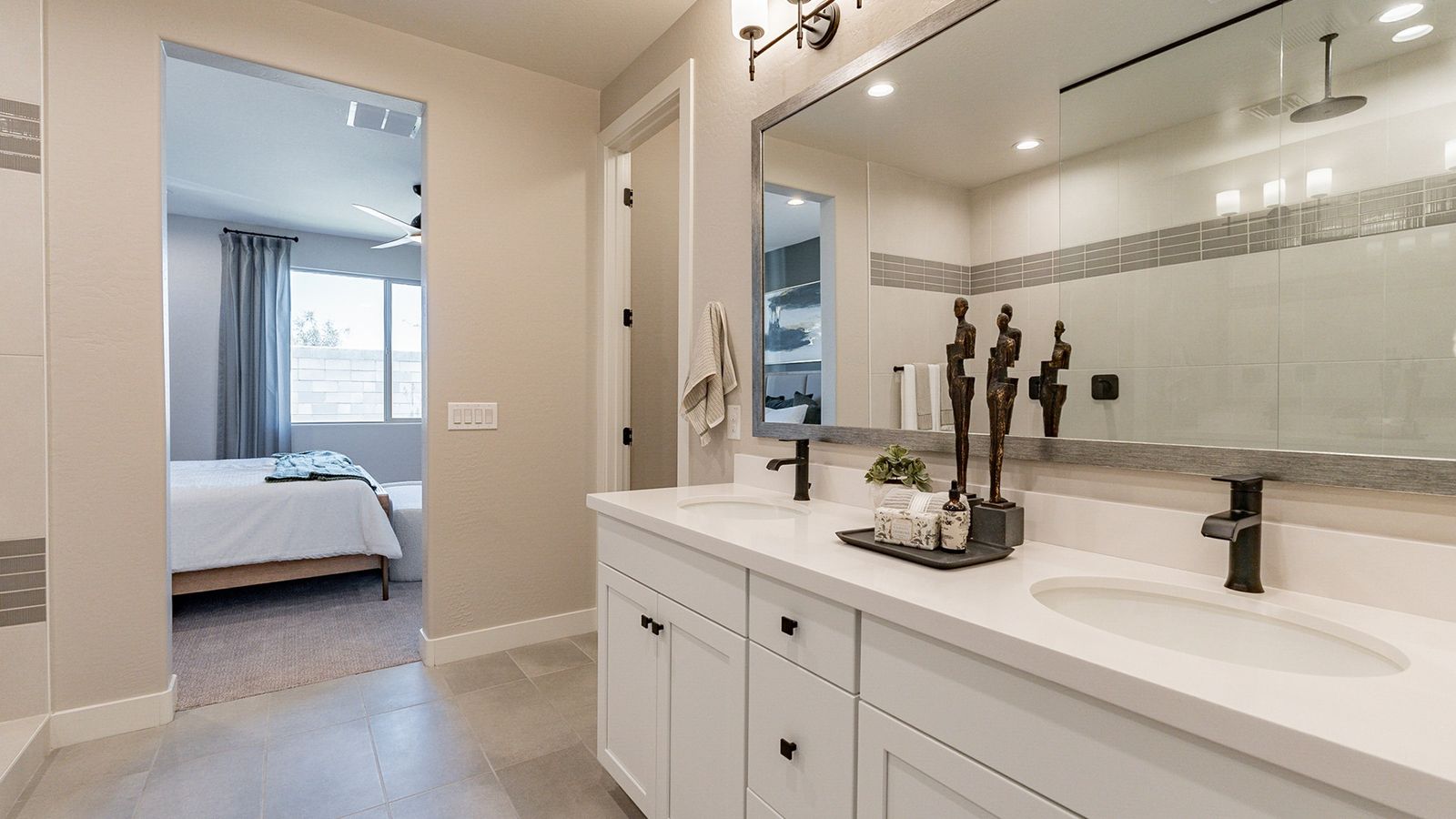 Sophisticated dual-sink bathroom in Sienna Park boasts sleek finishes and modern fixtures with luxury touches.