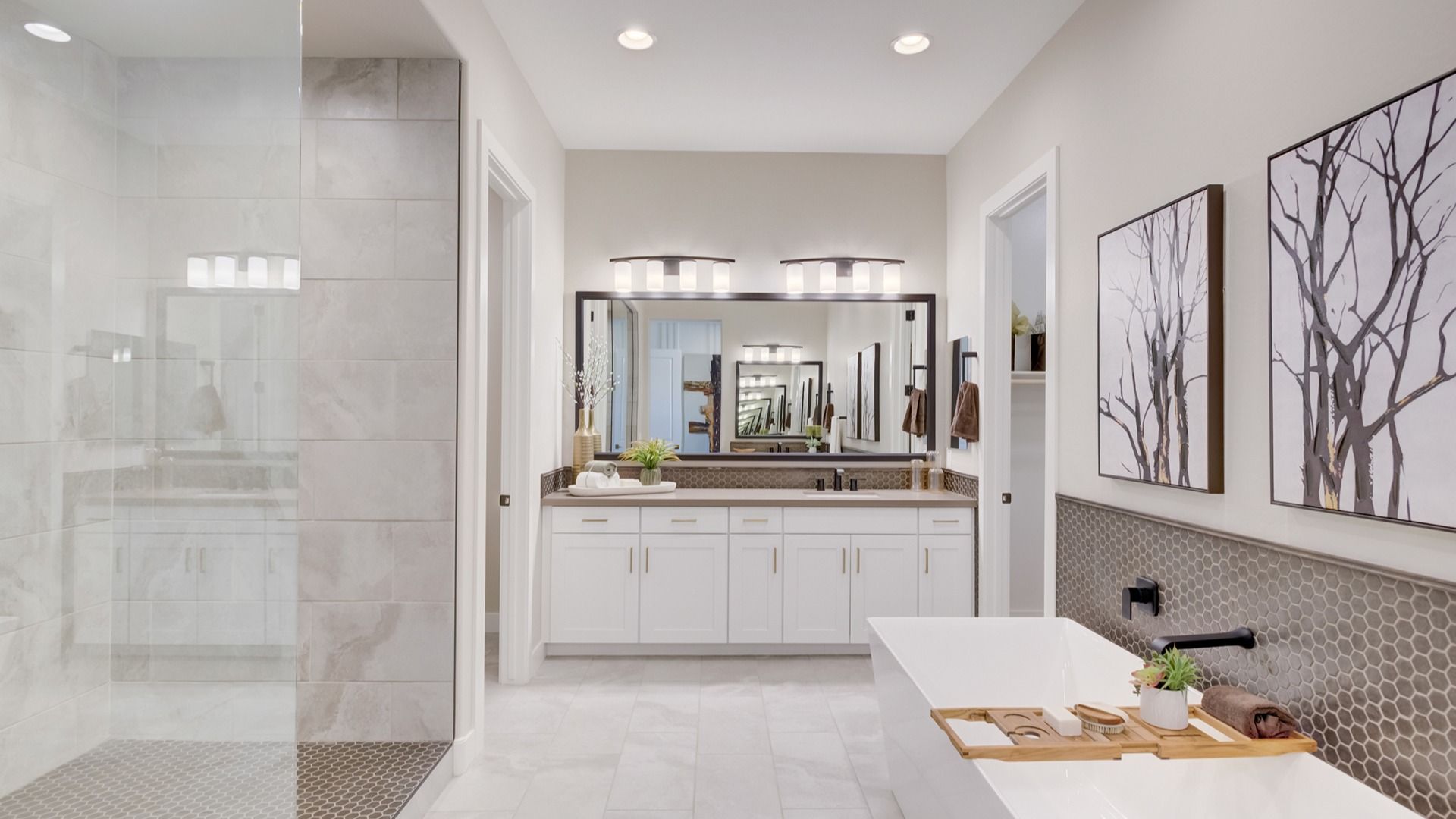 Indulge in a spacious soaking tub, chic hexagonal tile accents, and exquisite finishes in this Arroyo Seco home.
