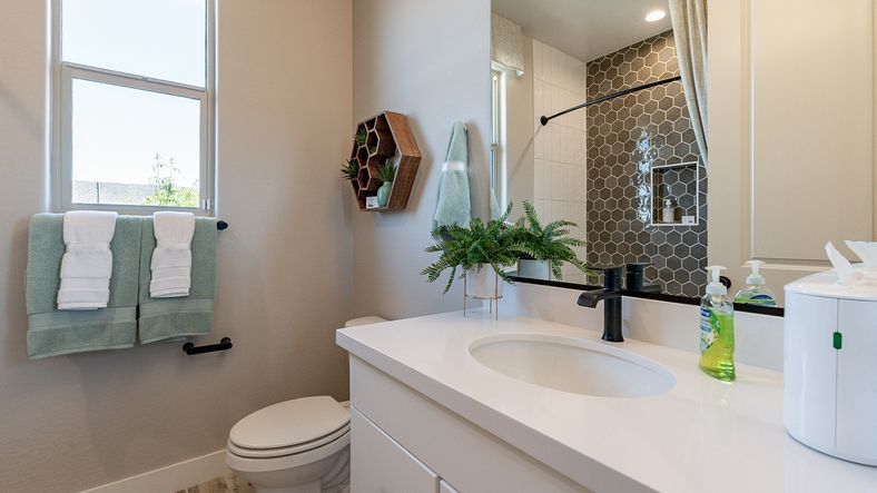 Experience elegance with hexagonal tiles and sleek fixtures in Sienna Park's premium residence.