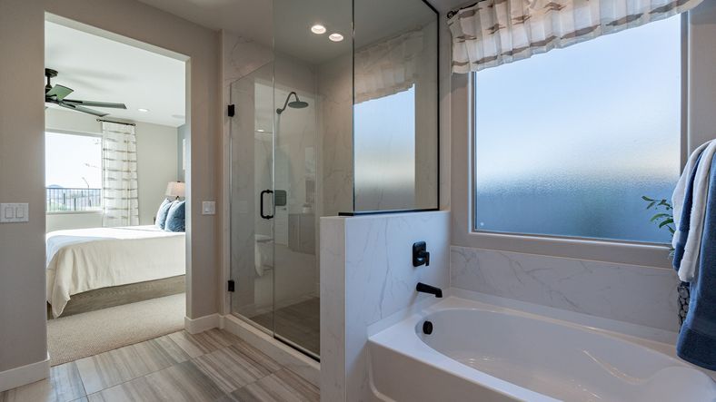 Indulge in luxury with elegant tile flooring and a sleek glass shower. The Villas at Mystic offers premium craftsmanship.