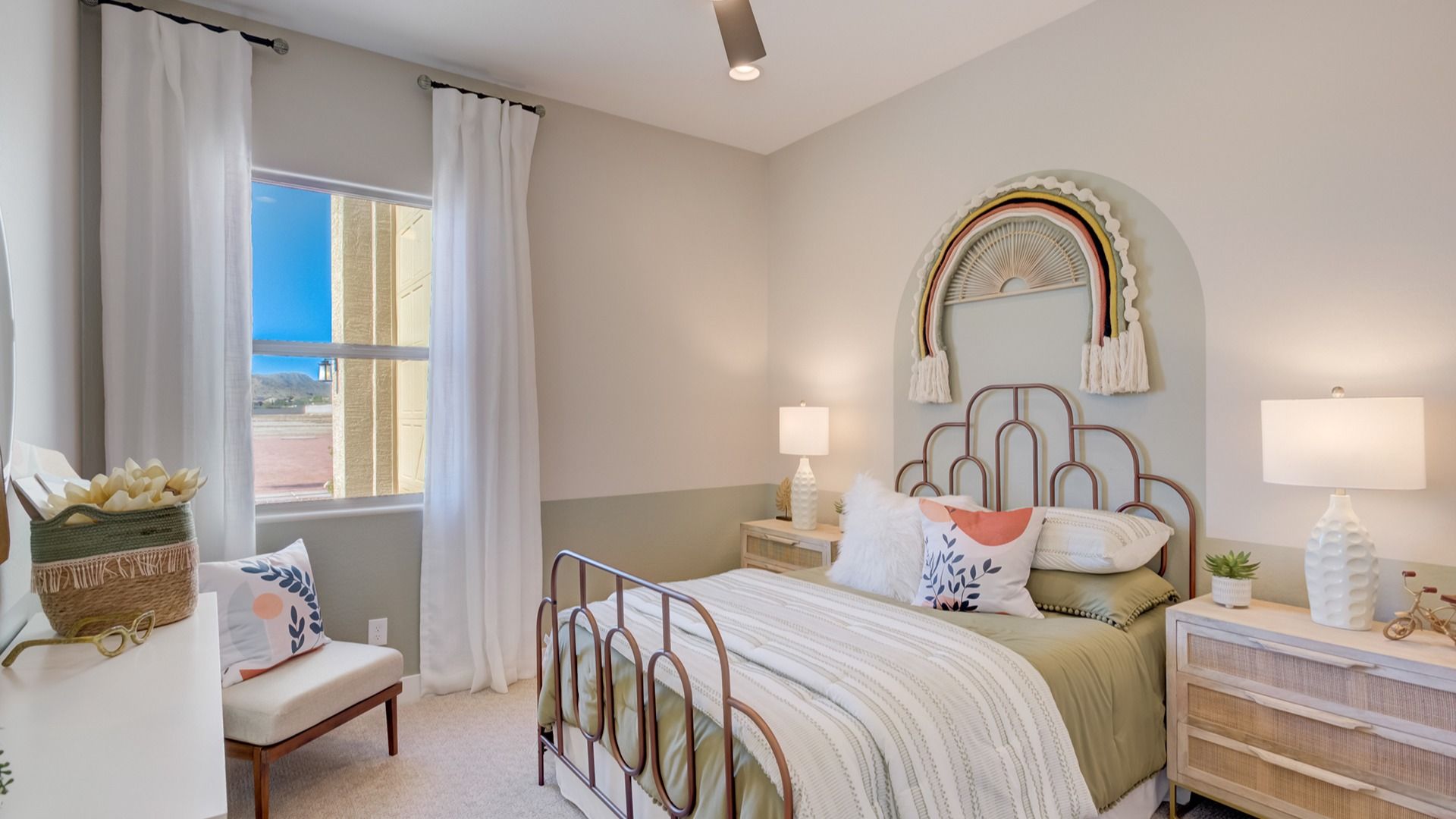 Experience luxury in a serene bedroom with elegant metal bed and chic woven accents at Arroyo Seco Palazzo.