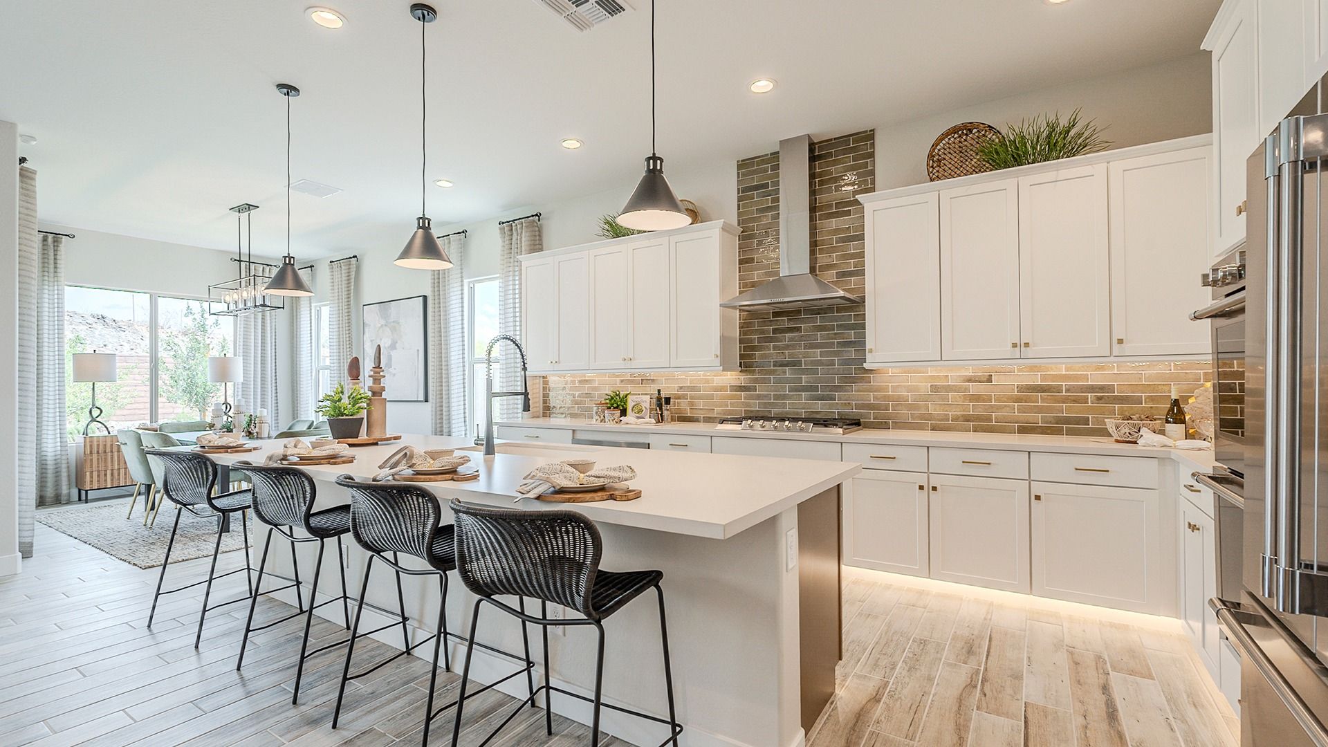 Revel in high-end finishes like tile backsplash and pendant lights in Hacienda at Estrella.