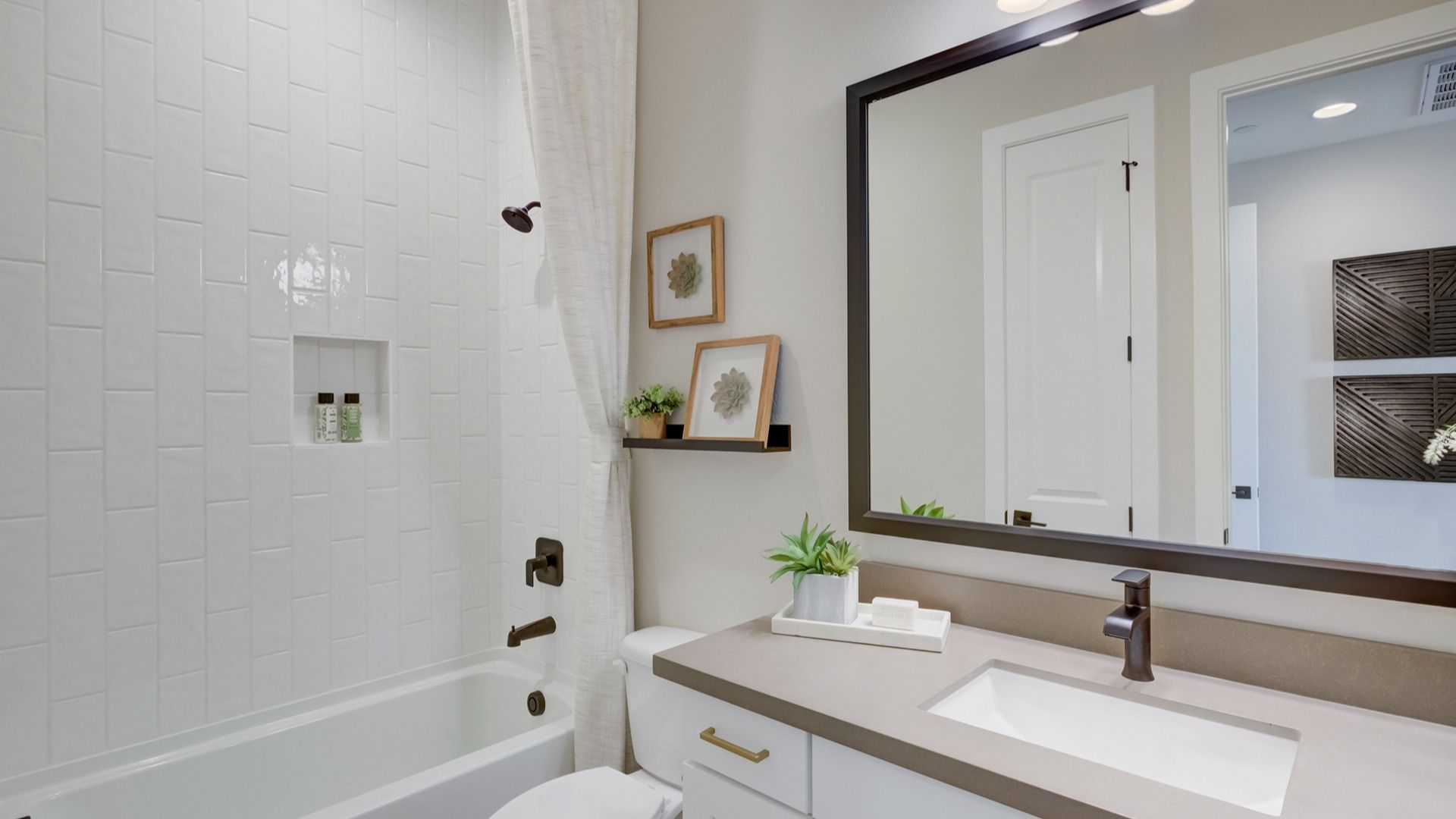 Experience timeless elegance with sleek subway tiles and sophisticated fixtures in Arroyo Seco.