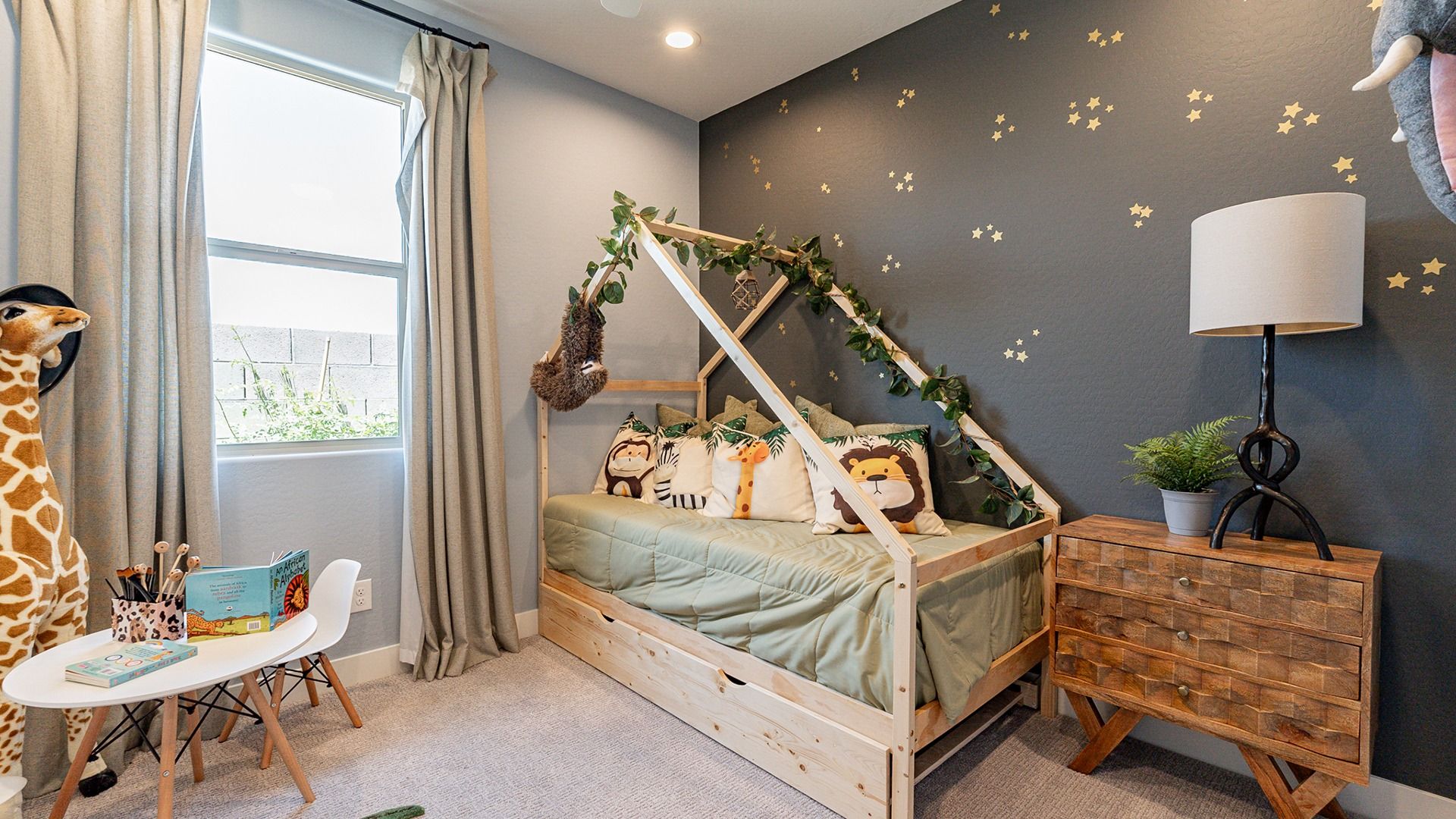 Experience the charm of a custom house bed, playful animal accents, and textured wood elements, Sienna Park.