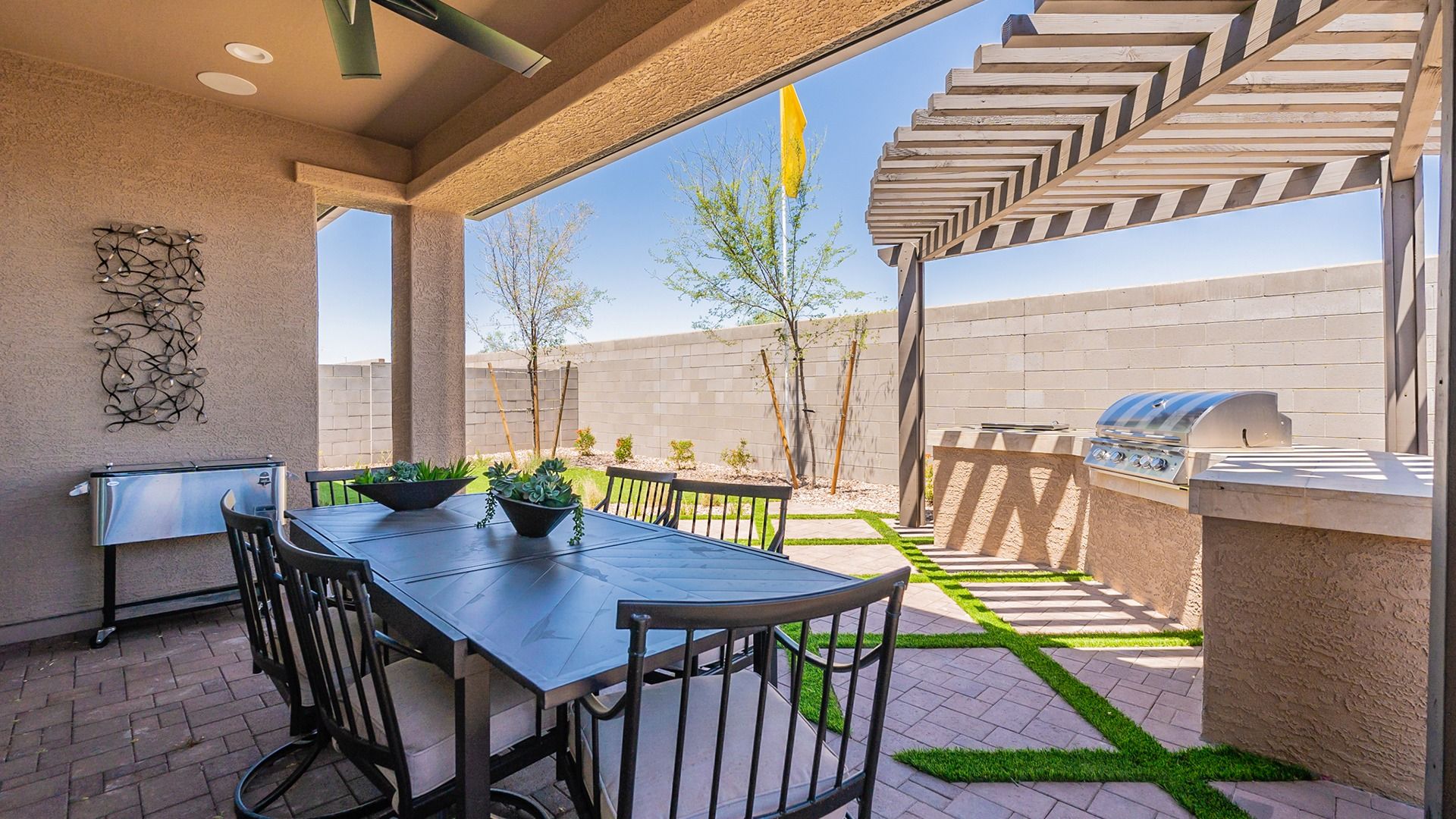Experience luxury with a modern pergola, elegant grilling station, and chic stone patio in Sienna Park.