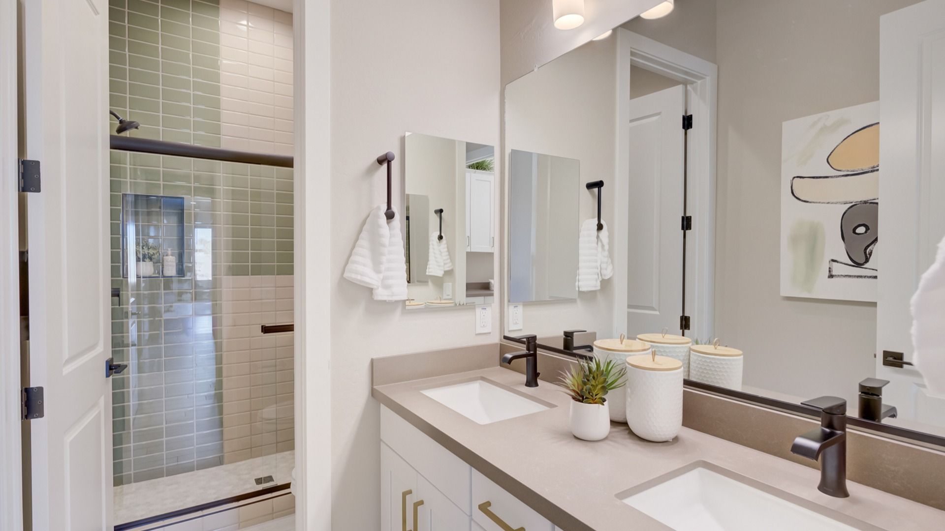 Sleek dual sinks and exquisite tile work epitomize luxury in Arroyo Seco's Palazzo residences.