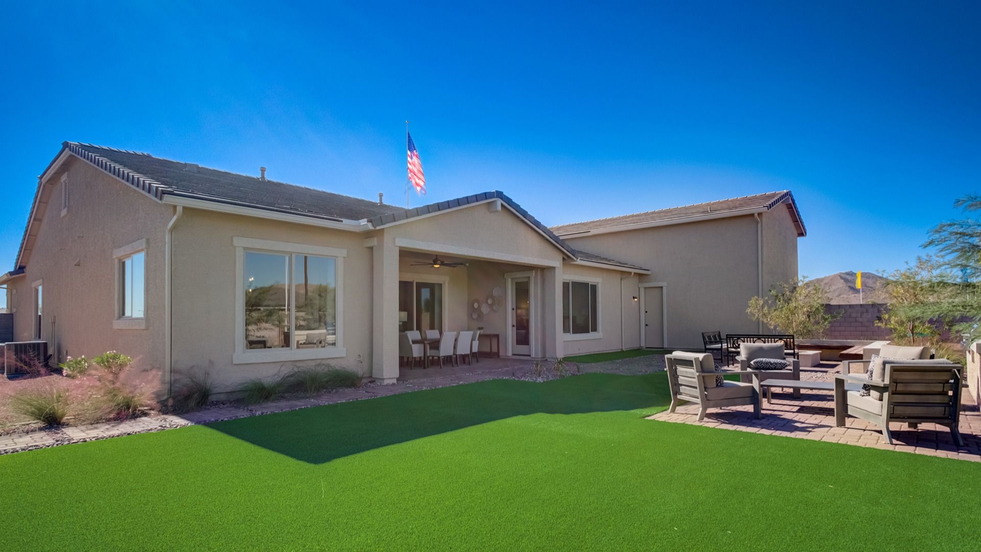 Experience elegance with expansive windows and a lush lawn in Arroyo Seco's Palazzo.